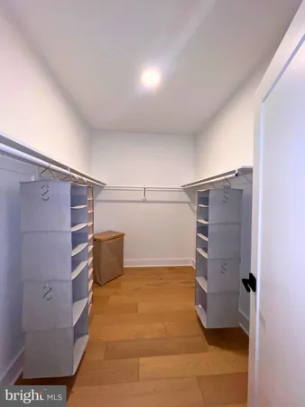 a bedroom with a bed and dresser