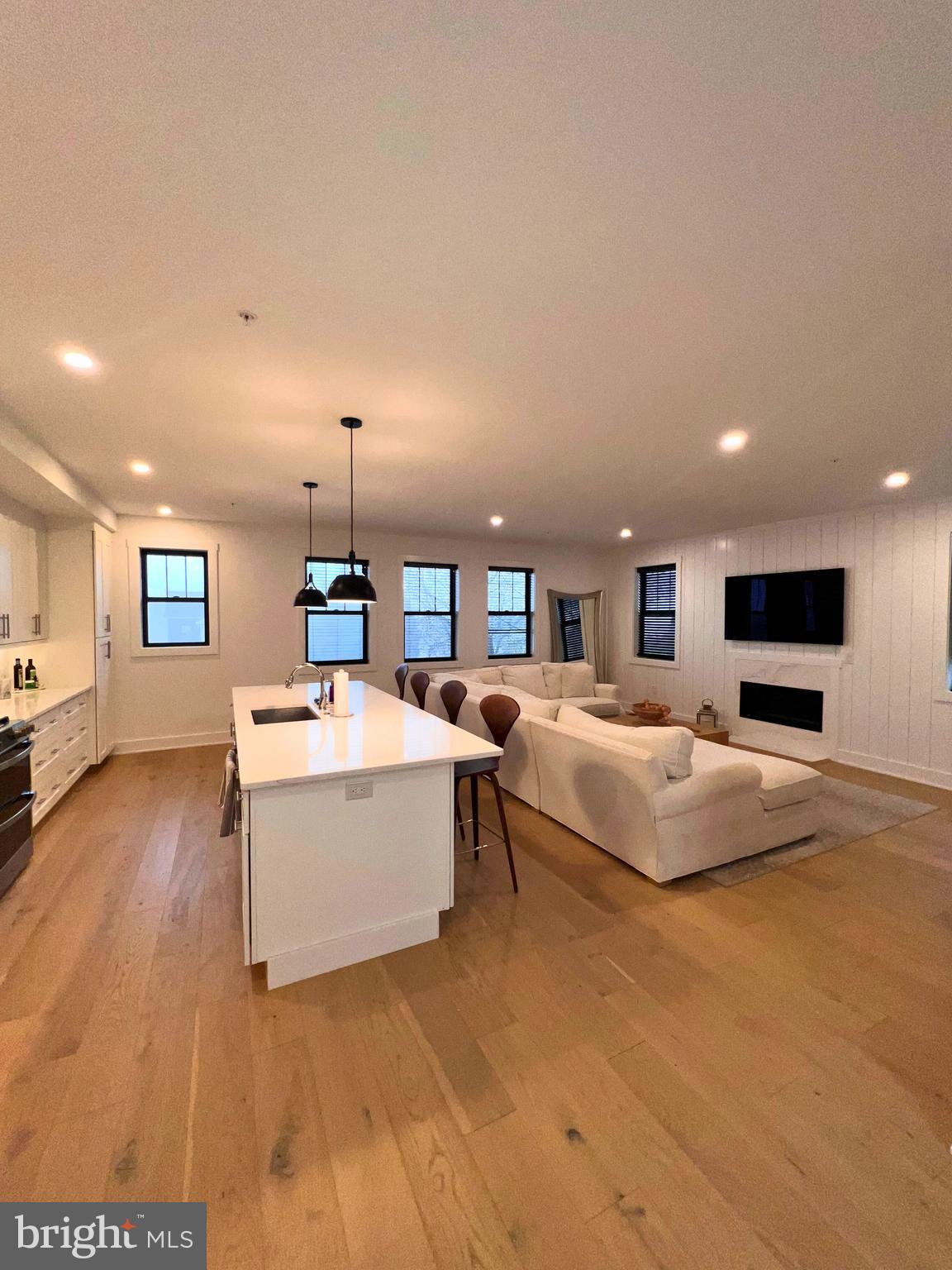 986 Henry Avenue Wayne, PA 19087 - Photo 2 of 32 a spacious bedroom with a bed and a flat screen tv