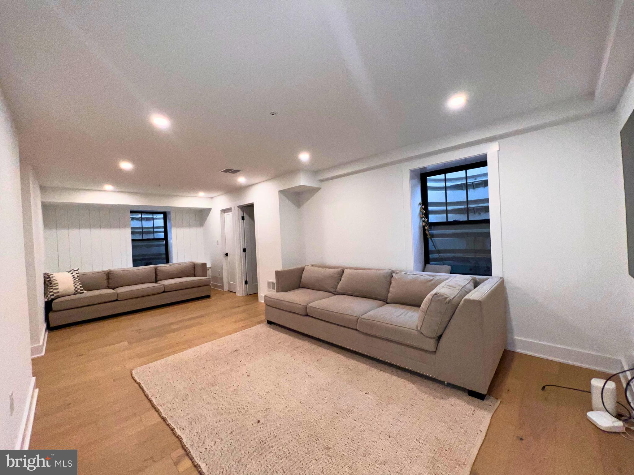 986 Henry Avenue Wayne, PA 19087 - Photo 25 of 32 a living room with furniture and a couch