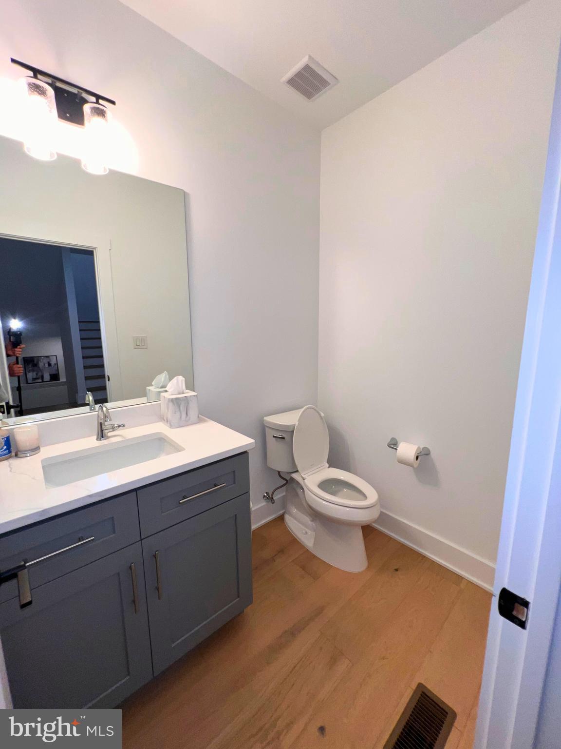 986 Henry Avenue Wayne, PA 19087 - Photo 26 of 32 a bathroom with a toilet a sink and mirror