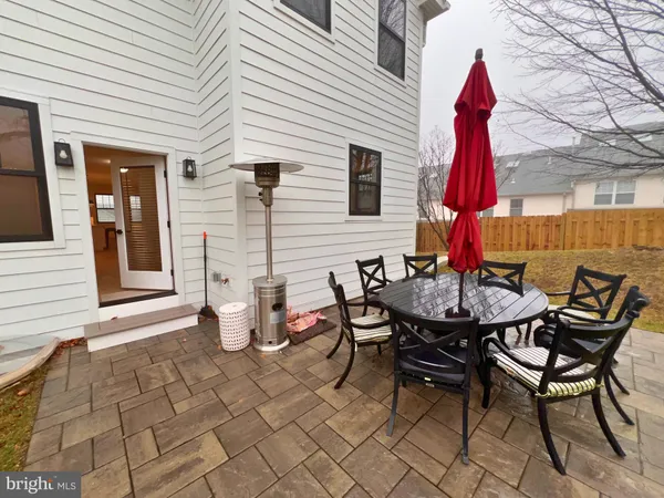 a patio with a yard and furniture