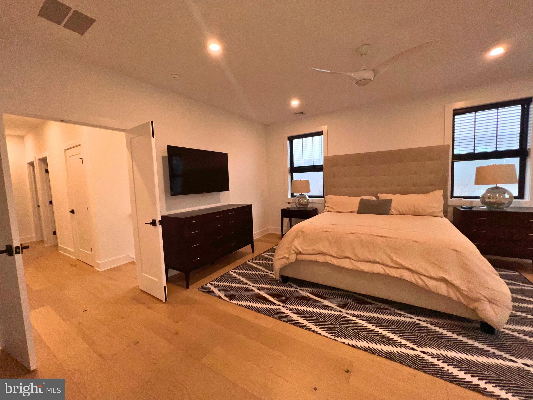 986 Henry Avenue Wayne, PA 19087 - Photo 32 of 32 a spacious bedroom with a bed and a flat screen tv