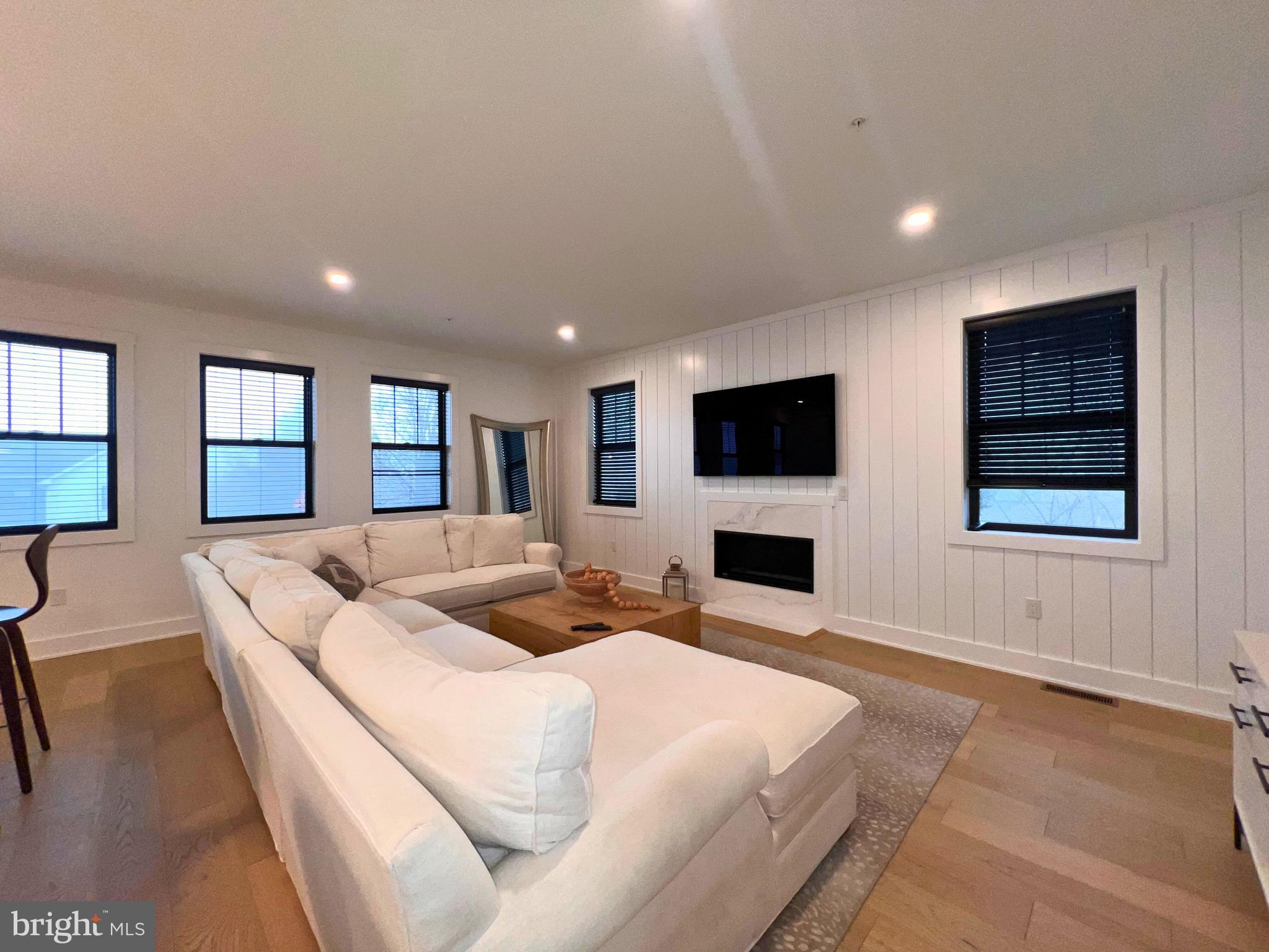 986 Henry Avenue Wayne, PA 19087 - Photo 7 of 32 a spacious bedroom with a large bed and a flat screen tv