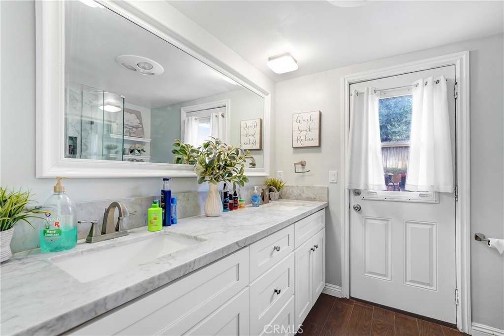 11800 Gager Street Sylmar, CA 91342 - Photo 13 of 25 a bathroom with sink and mirror