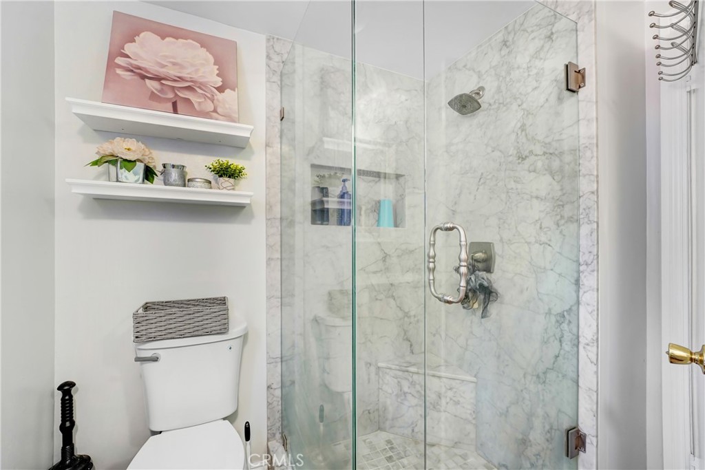 11800 Gager Street Sylmar, CA 91342 - Photo 14 of 25 a bathroom with a toilet and a shower