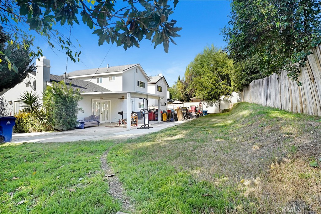 11800 Gager Street Sylmar, CA 91342 - Photo 22 of 25 a view of a house with a back yard