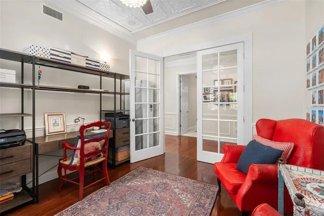 a bathroom with a double vanity sink a toilet and a mirror