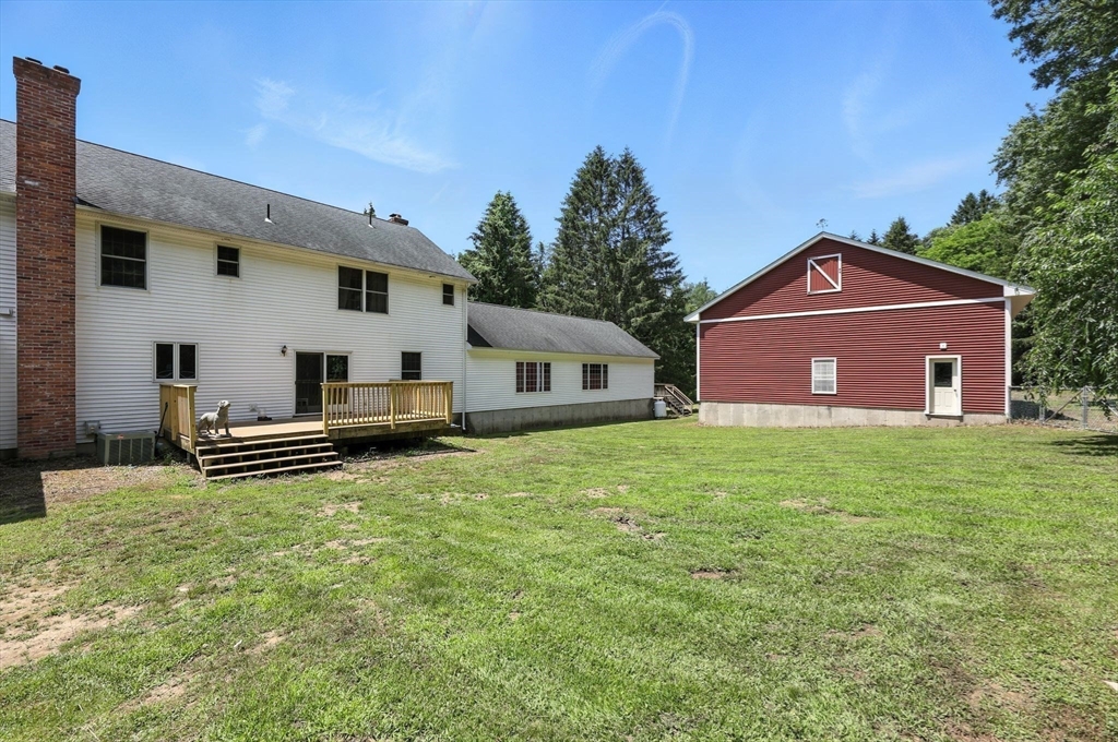 285 Lower Hampden Road Monson, MA 01057 - Photo 2 of 40 a front view of a house with a garden
