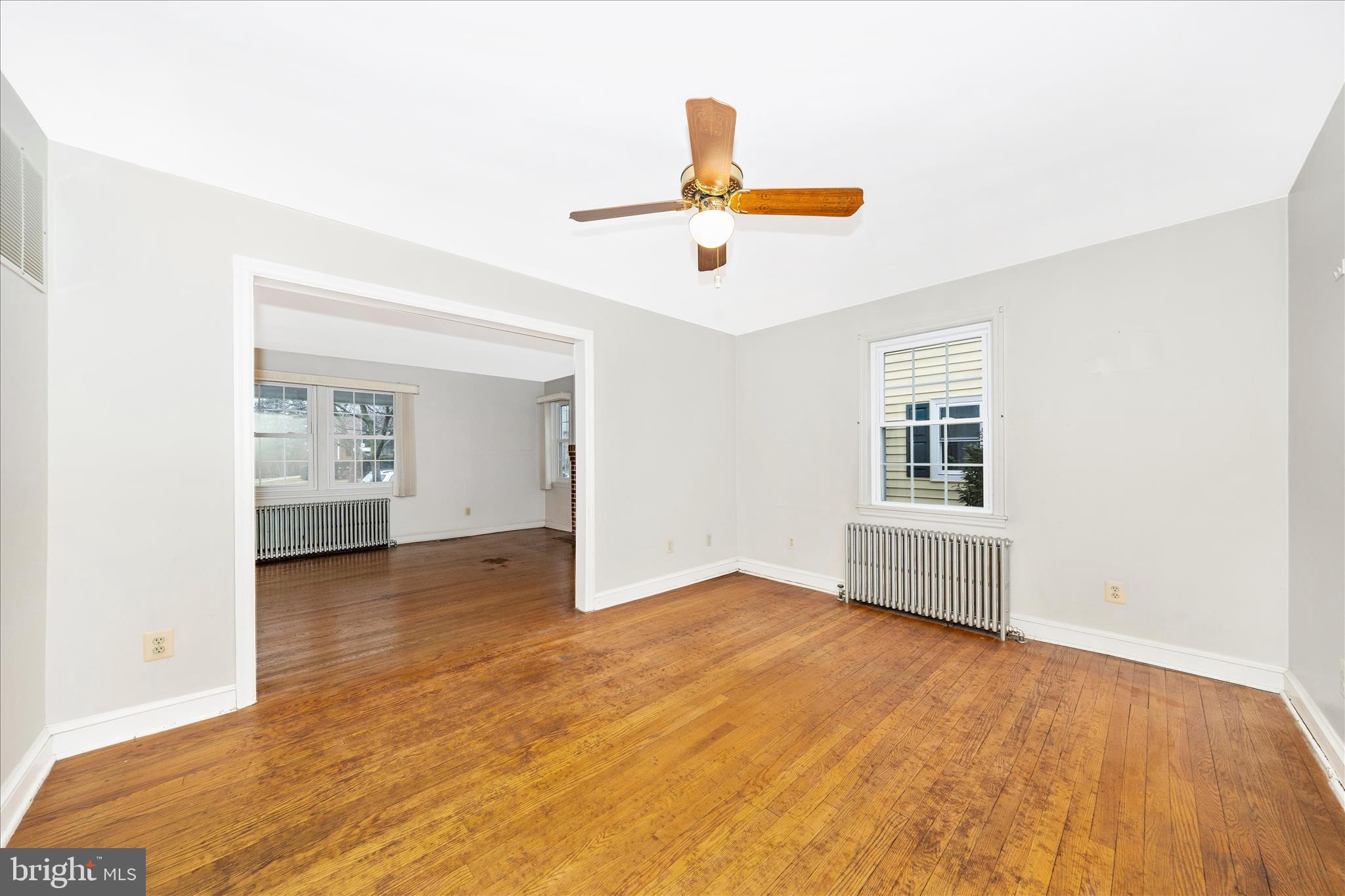 9 East 13th Street Frederick, MD 21701 - Photo 11 of 51 a view of an empty room with chandelier fan and a window