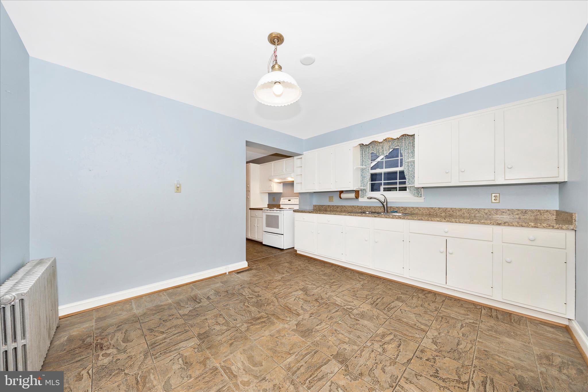 9 East 13th Street Frederick, MD 21701 - Photo 12 of 51 a kitchen with granite countertop white cabinets and white stainless steel appliances