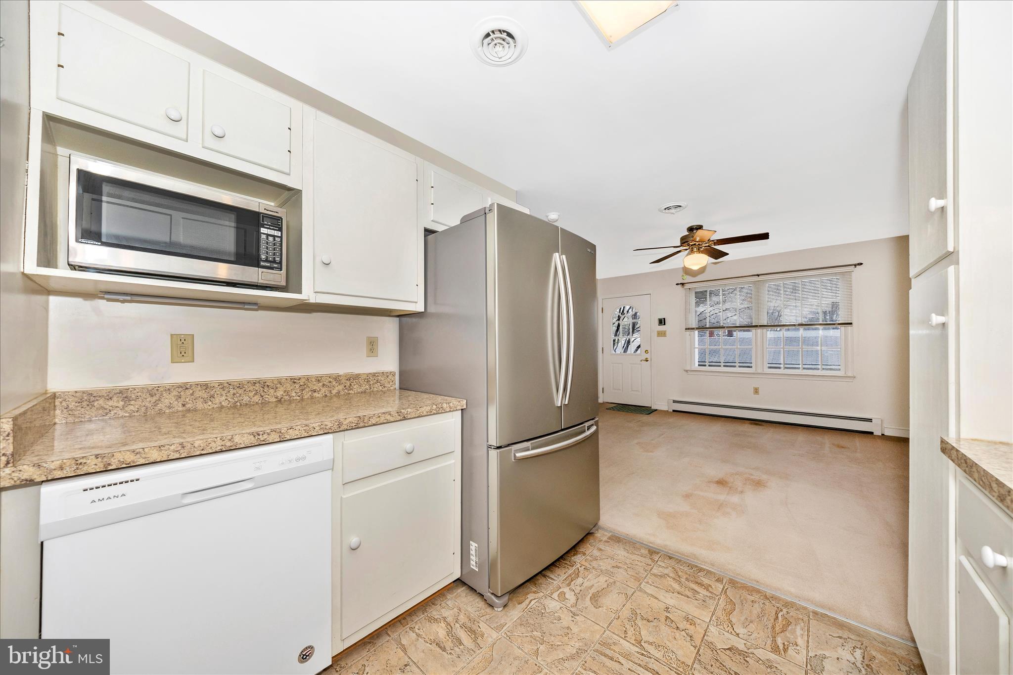 9 East 13th Street Frederick, MD 21701 - Photo 17 of 51 a kitchen with stainless steel appliances granite countertop a refrigerator and a stove top oven