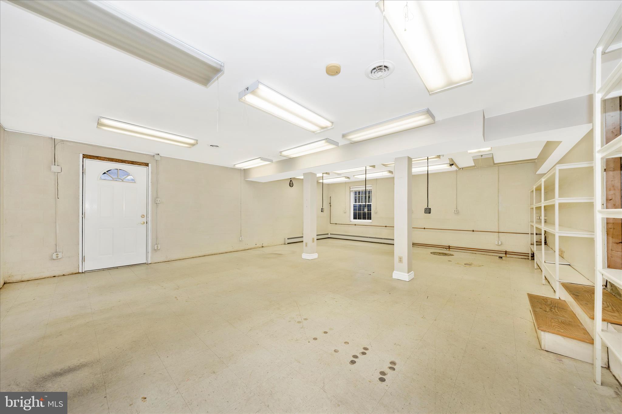 9 East 13th Street Frederick, MD 21701 - Photo 35 of 51 a view of a room with gym equipment and closet