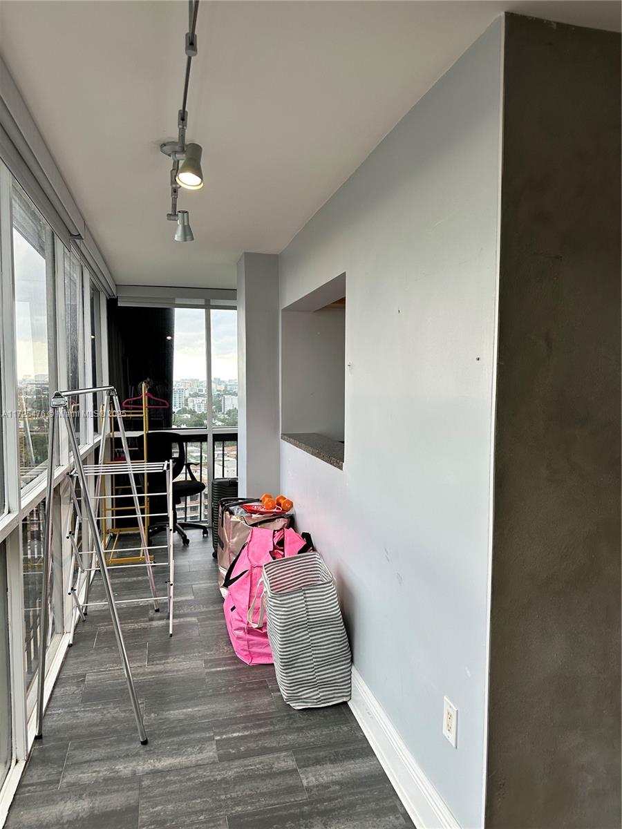 2333 Brickell Avenue, Unit 2116 Miami, FL 33129 - Photo 11 of 32 a bedroom with furniture and a flat screen tv