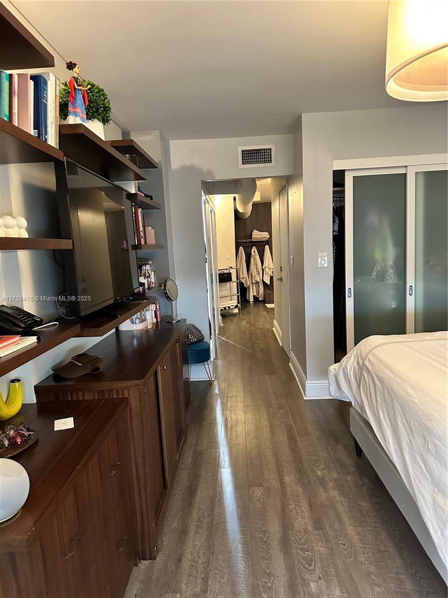 2333 Brickell Avenue, Unit 2116 Miami, FL 33129 - Photo 13 of 32 a bedroom with furniture and a window