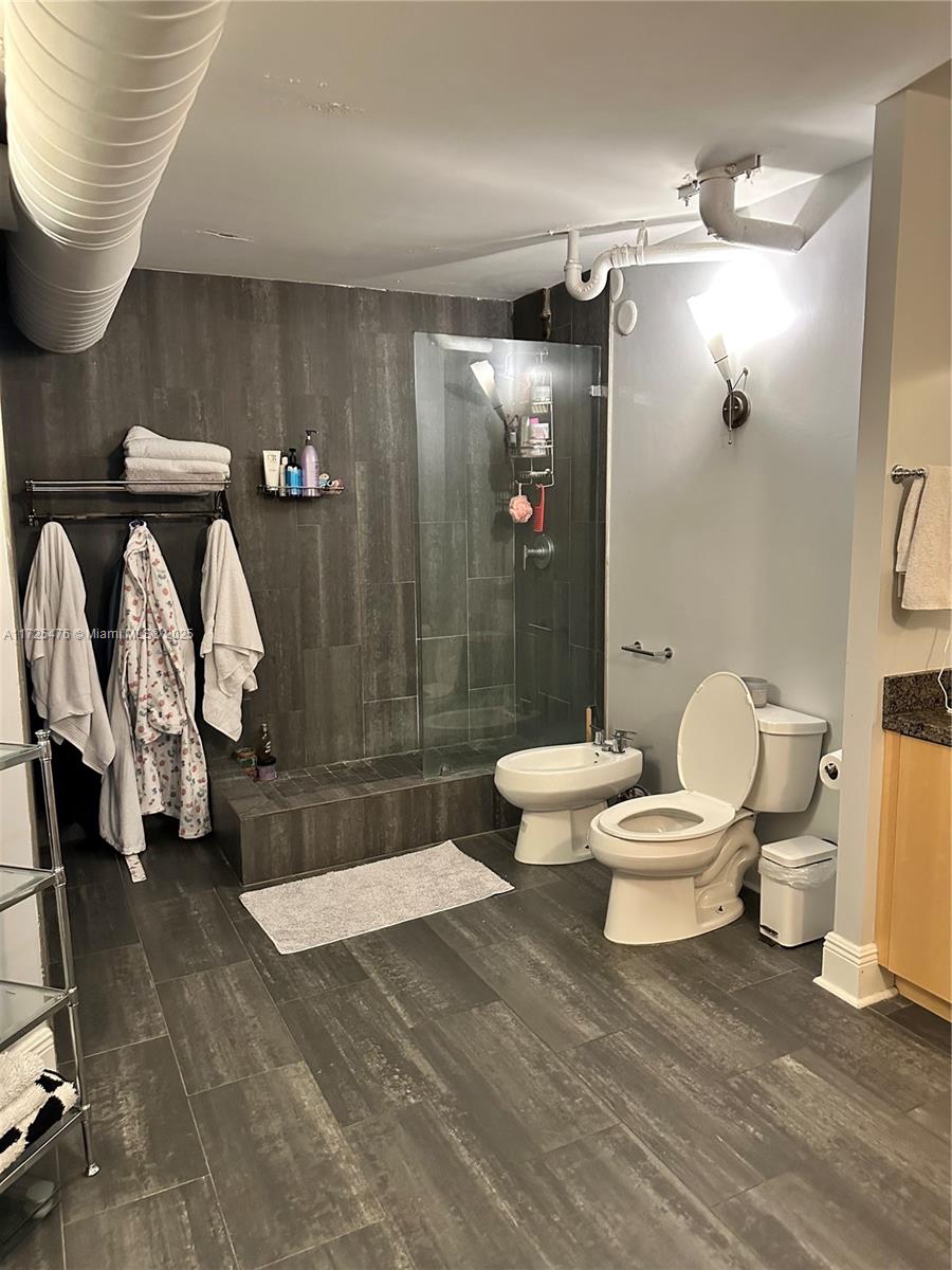 2333 Brickell Avenue, Unit 2116 Miami, FL 33129 - Photo 14 of 32 a bathroom with a toilet and a shower