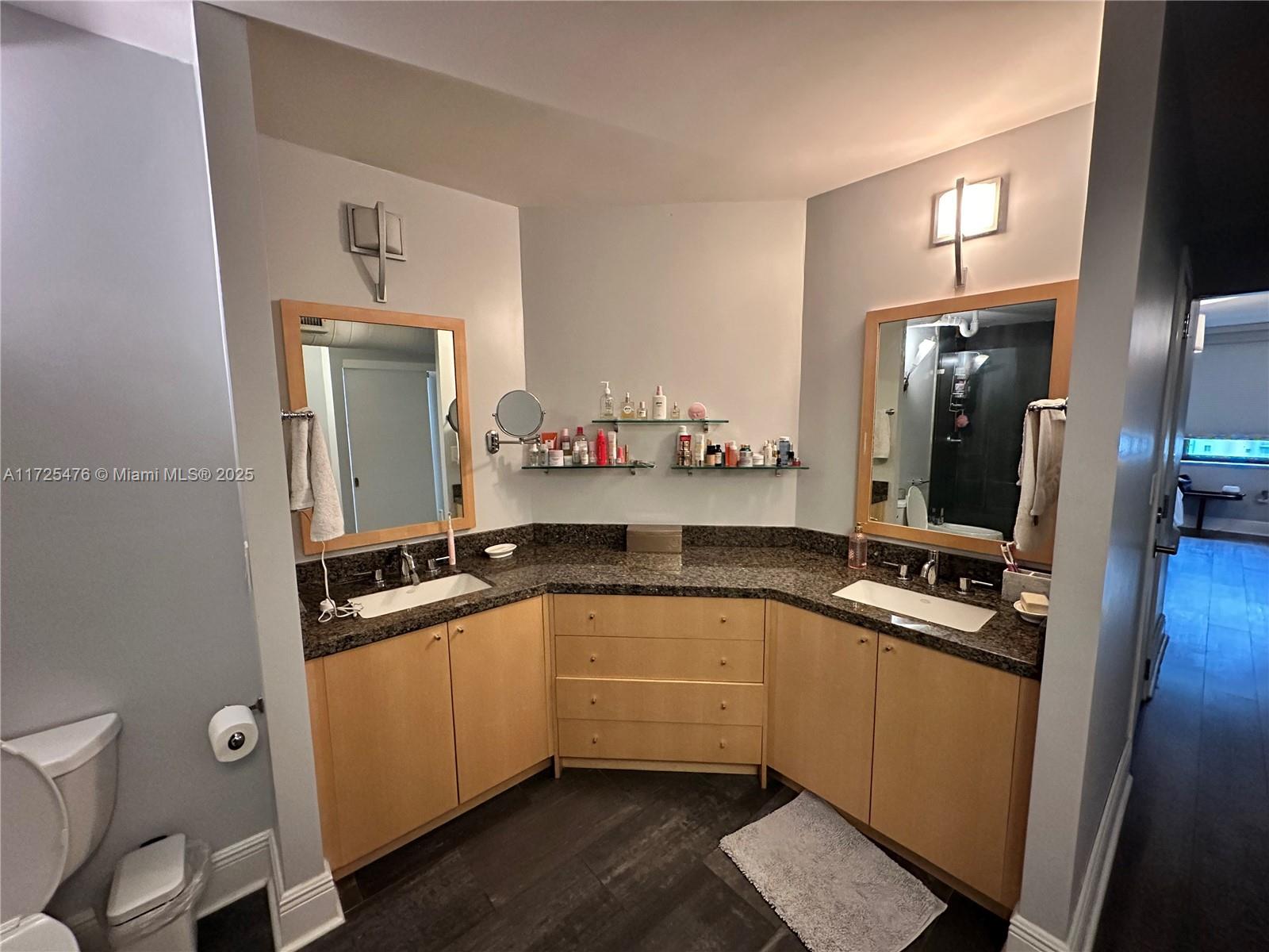 2333 Brickell Avenue, Unit 2116 Miami, FL 33129 - Photo 15 of 32 a kitchen with a sink and cabinets