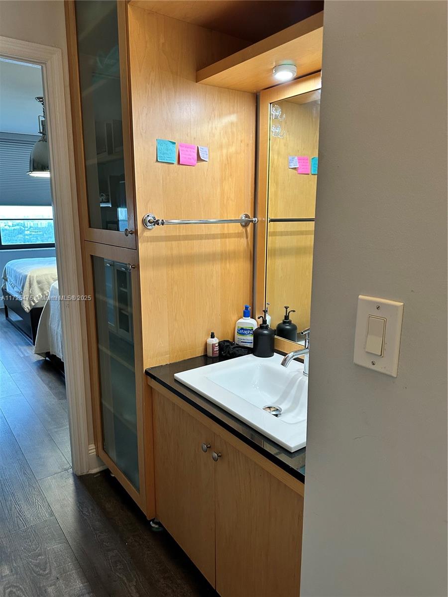 2333 Brickell Avenue, Unit 2116 Miami, FL 33129 - Photo 24 of 32 a bathroom with a sink and a mirror