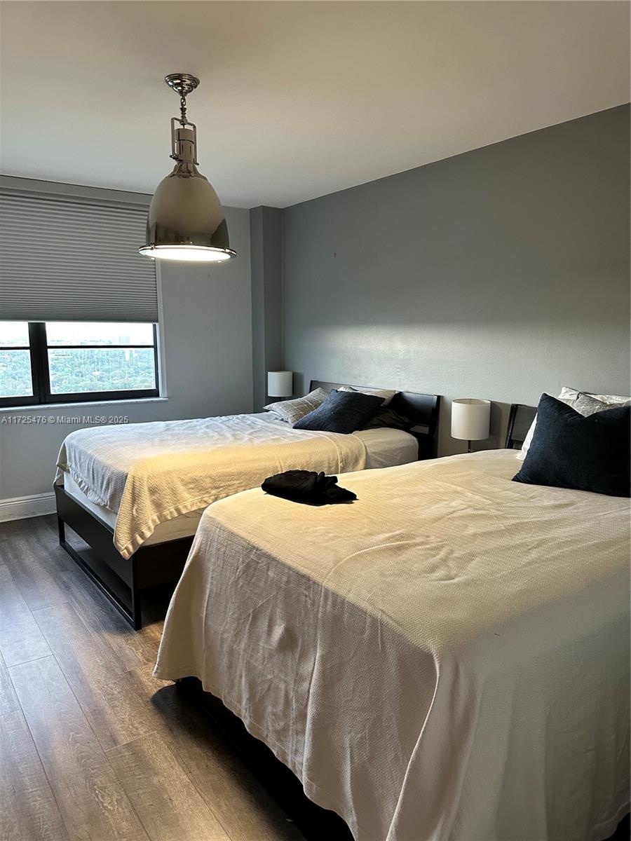 2333 Brickell Avenue, Unit 2116 Miami, FL 33129 - Photo 26 of 32 a bedroom with double bed and a window