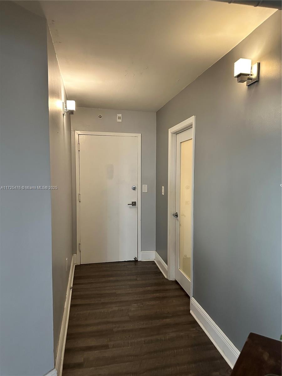 2333 Brickell Avenue, Unit 2116 Miami, FL 33129 - Photo 30 of 32 a view of a hallway with wooden floor