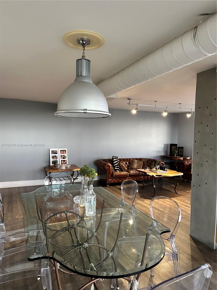 2333 Brickell Avenue, Unit 2116 Miami, FL 33129 - Photo 8 of 32 a kitchen with a stove and a chandelier