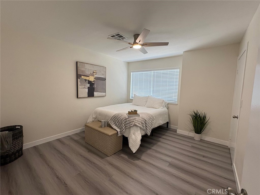 810 West Compton Boulevard, Unit 9 Compton, CA 90220 - Photo 13 of 16 a bed sitting in a bedroom next to a window