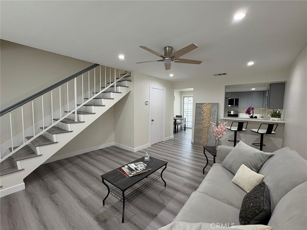 810 West Compton Boulevard, Unit 9 Compton, CA 90220 - Photo 2 of 16 a living room with furniture and wooden floor