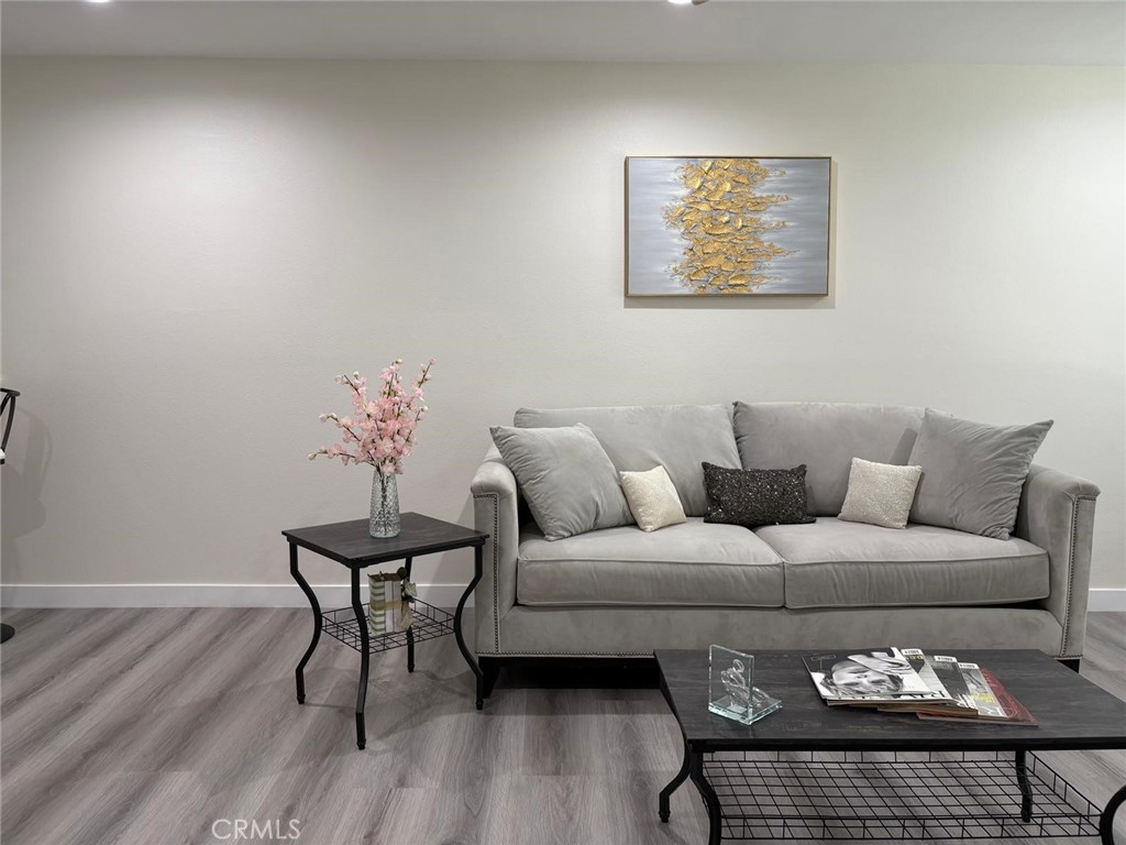 810 West Compton Boulevard, Unit 9 Compton, CA 90220 - Photo 4 of 16 a living room with furniture and wooden floor