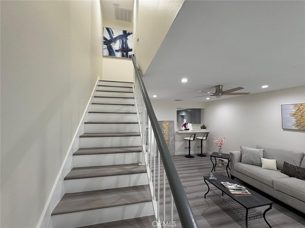 810 West Compton Boulevard, Unit 9 Compton, CA 90220 - Photo 9 of 16 a living room with furniture and a stairs