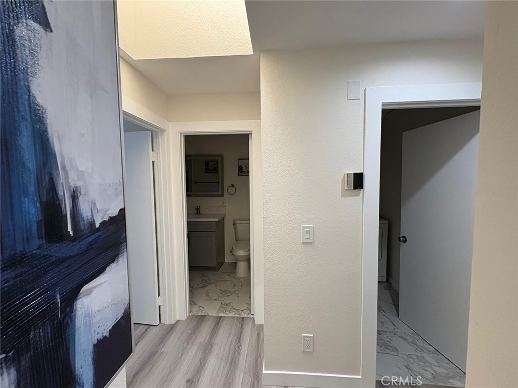 810 West Compton Boulevard, Unit 9 Compton, CA 90220 - Photo 10 of 16 a view of a hallway with a wooden closet