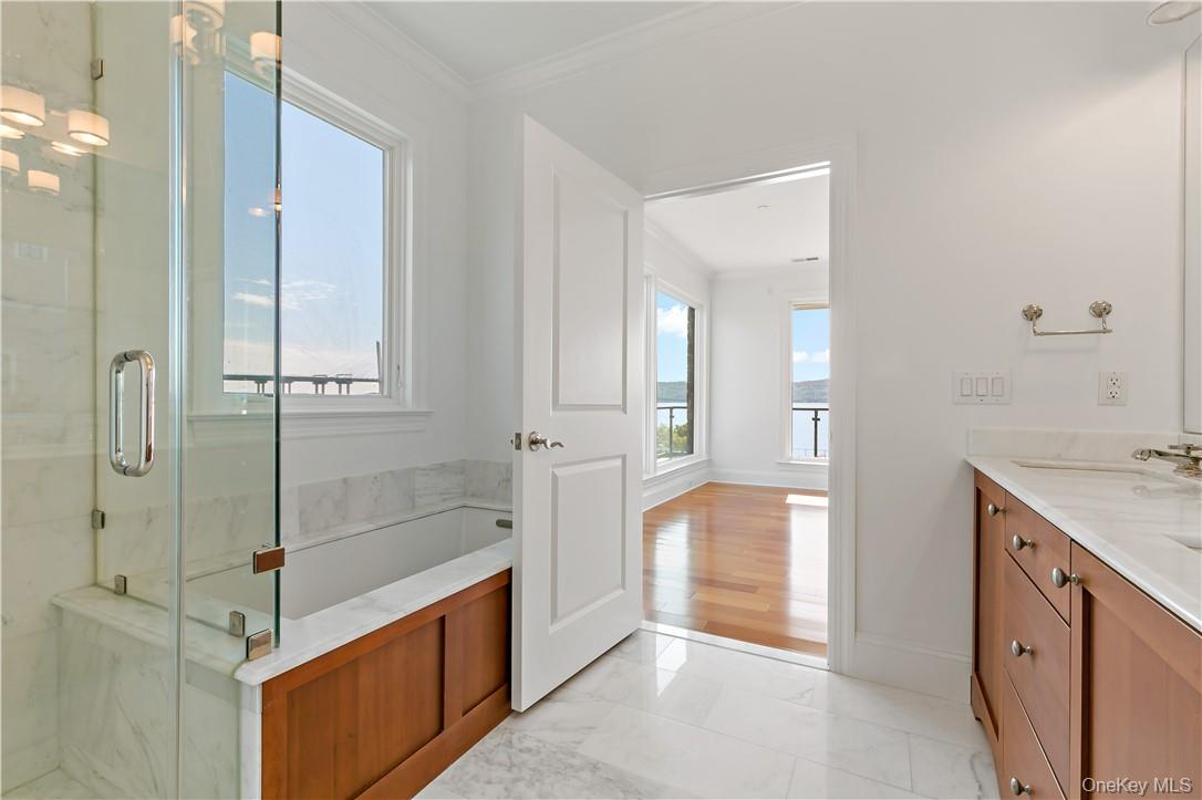16 Rivers Edge Drive, Unit 200 Tarrytown, NY 10591 - Photo 13 of 19 a bathroom with a tub shower and sink