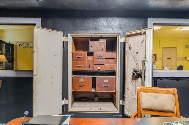 a living room with lots of furniture and a chandelier