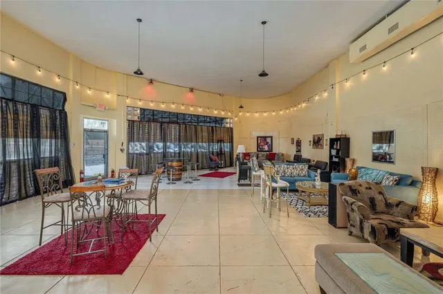 a kitchen with stainless steel appliances kitchen island granite countertop a sink stove and cabinets