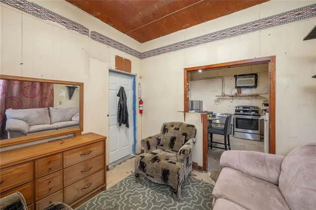 a view of a chairs and table in front of house