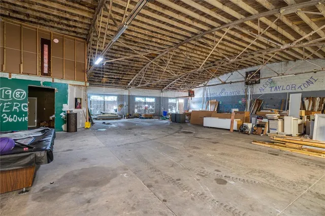 a living room filled with furniture and a chandelier