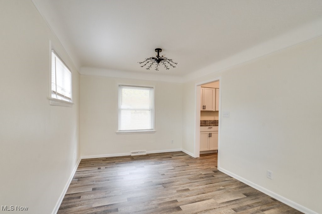 6961 Maplewood Road Parma Heights, OH 44130 - Photo 9 of 22 Empty room featuring light hardwood / wood-style floors