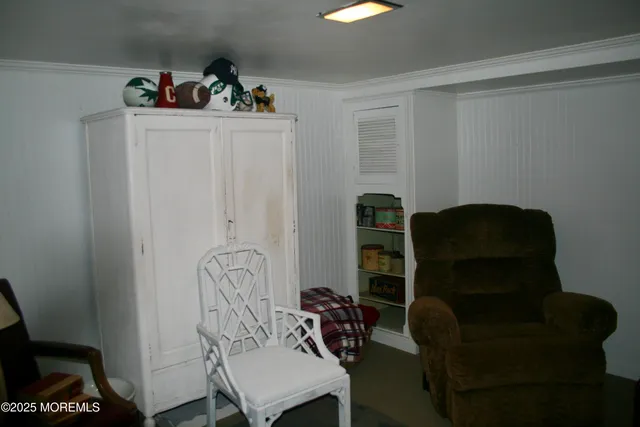 a view of a workspace with furniture and wooden floor