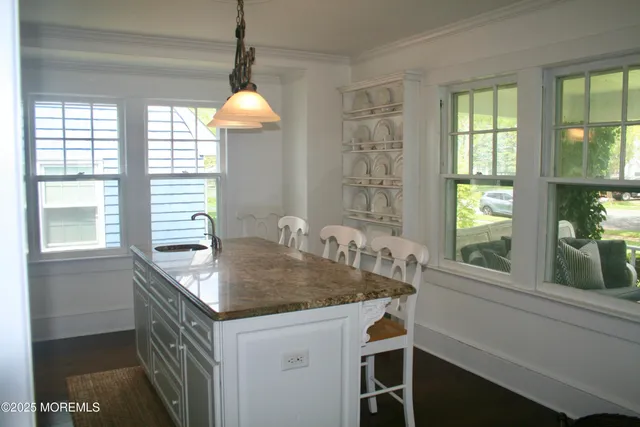 a kitchen that has a sink and a window
