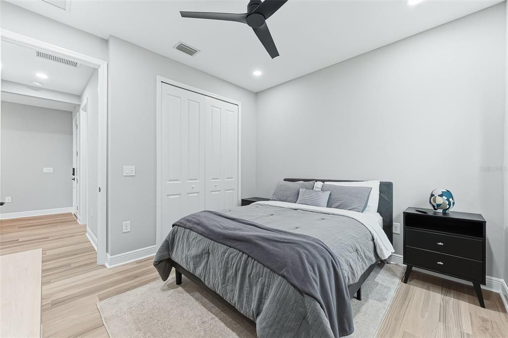 4191 Pegasus Way Naples, FL 34120 - Photo 24 of 48 a bedroom with a bed and a cabinets
