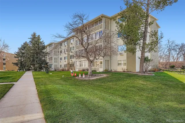 a view of a building with a yard