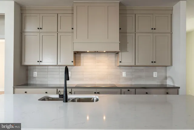 a bathroom with a double vanity sink mirror and shower