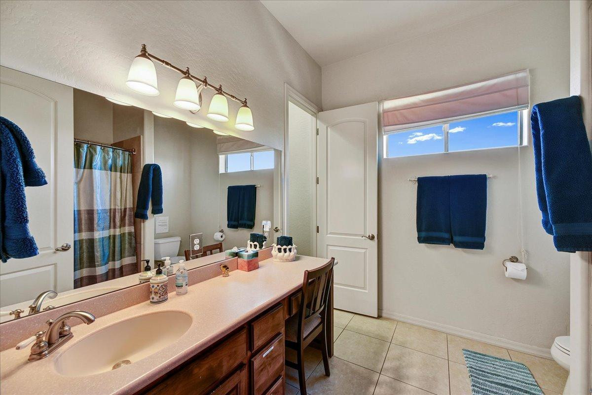 412 East Yearling Road Phoenix, AZ 85085 - Photo 20 of 51 a bathroom with a double vanity sink a mirror and shower