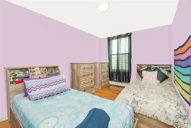 a bedroom with a bed and a closet