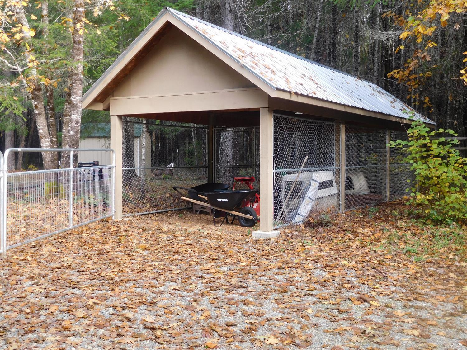 7133 Rockydale Road Cave Junction, OR 97523 - Photo 22 of 23 Covered dog kennel/run, big enough to di