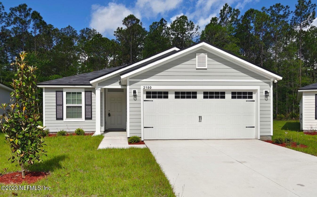 2180 Kistlers Rdg Way Jacksonville, FL 32221 - Photo 1 of 1 a view of a white house with yard