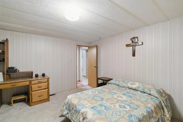 a kitchen with granite countertop a sink cabinets and stainless steel appliances