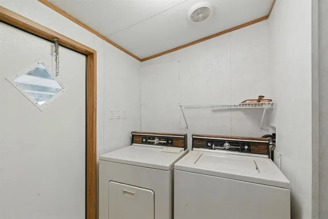 a bathroom with a toilet and a shower curtain