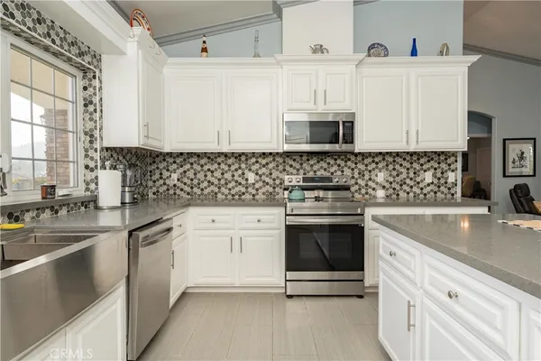 a spacious bathroom with a double vanity sink and a mirror