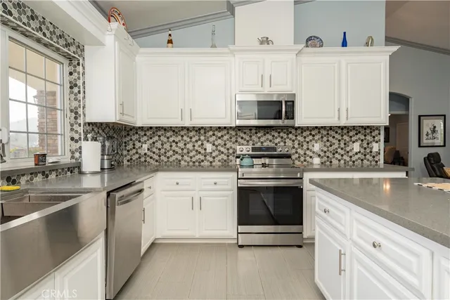 a spacious bathroom with a double vanity sink and a mirror