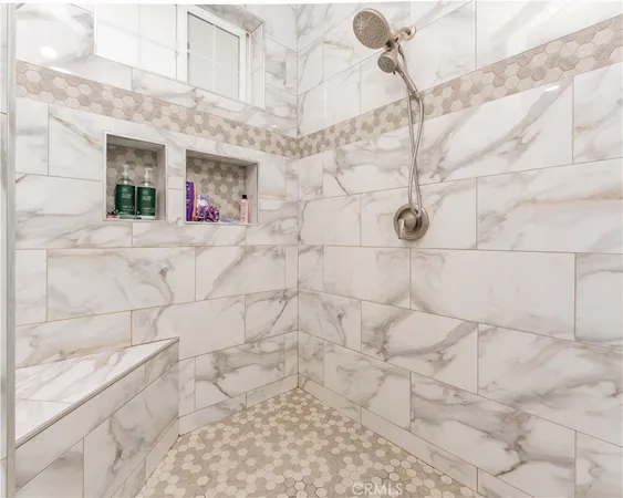 a bedroom with furniture and a flat screen tv