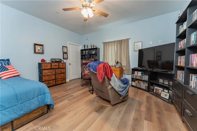 a bathroom with a sink a toilet a mirror and shower